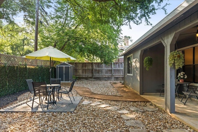 2612 Monarch Dr, Austin, TX 78748 - fenced backyard with a storage unit, a patio, and outdoor dining space