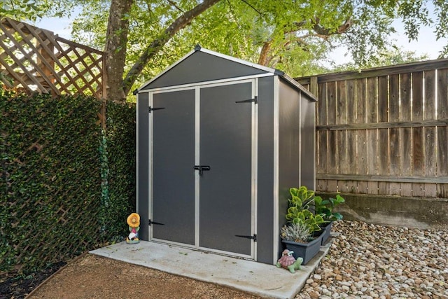 view of shed featuring a fenced backyard