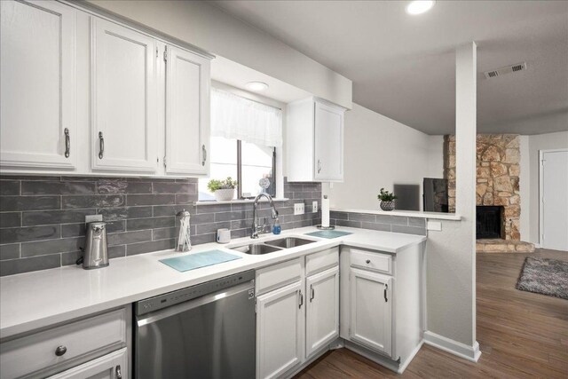 2612 Monarch Dr, Austin, TX 78748 - kitchen featuring stainless steel dishwasher, dark wood-type flooring, and light countertops