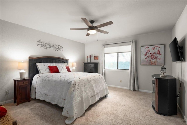 bedroom with baseboards, light carpet, and a ceiling fan