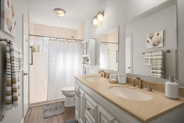 full bath featuring healthy amount of natural light, wood finished floors, toilet, and curtained shower