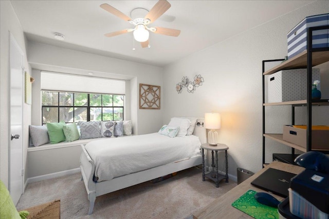 bedroom featuring carpet, baseboards, and ceiling fan