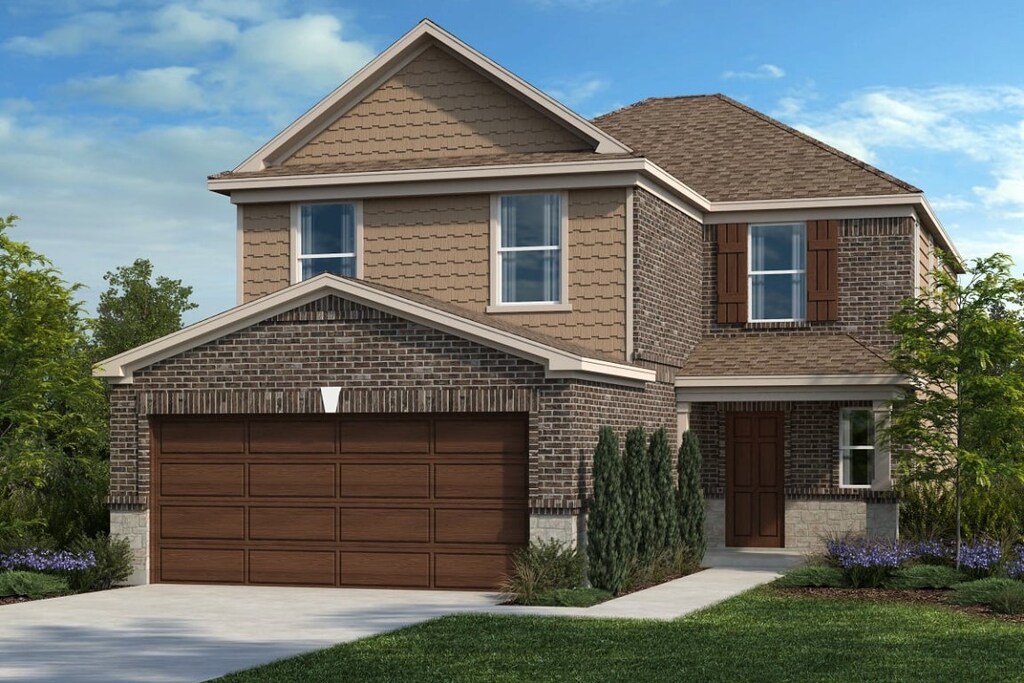view of front facade with brick siding, driveway, an attached garage, and a shingled roof