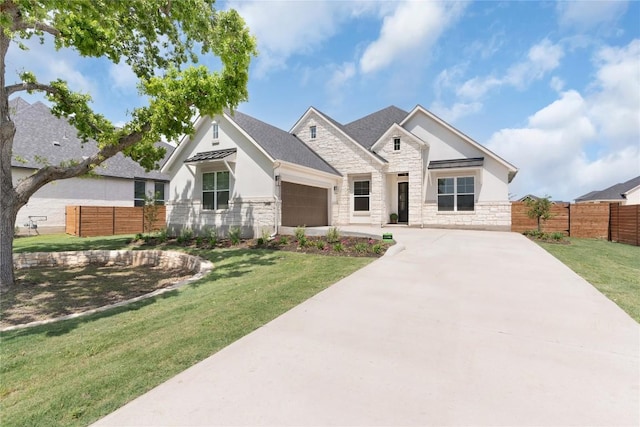 232 San Xavier St, Georgetown, TX 78633 - view of front facade with stone siding, stucco siding, concrete driveway, a garage, and a shingled roof