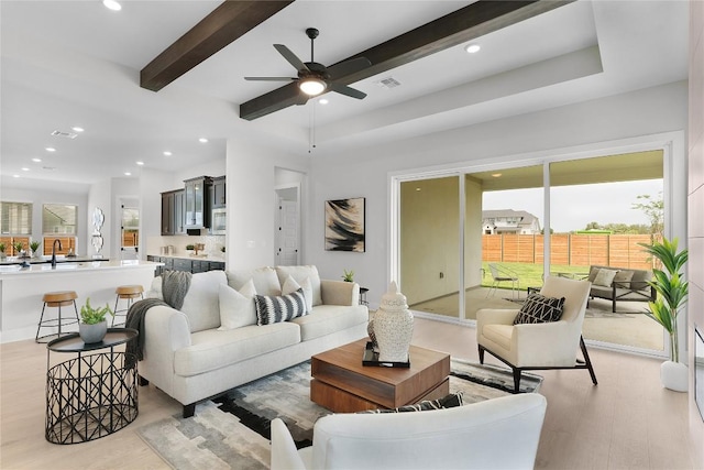 232 San Xavier St, Georgetown, TX 78633 - living area featuring ceiling fan, light wood finished floors, beamed ceiling, and recessed lighting