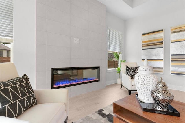 232 San Xavier St, Georgetown, TX 78633 - living room with wood finished floors and a tiled fireplace