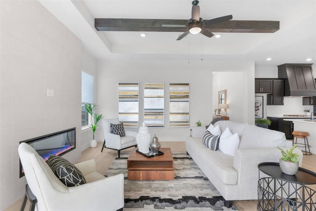 232 San Xavier St, Georgetown, TX 78633 - living area with light wood-type flooring, a ceiling fan, a tile fireplace, and recessed lighting