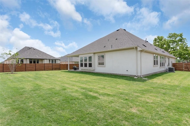 232 San Xavier St, Georgetown, TX 78633 - back of property with central AC unit, stucco siding, and roof with shingles