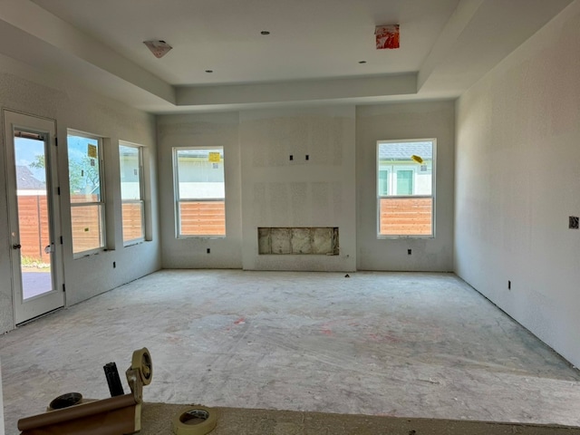 232 San Xavier St, Georgetown, TX 78633 - unfurnished living room featuring plenty of natural light and a raised ceiling