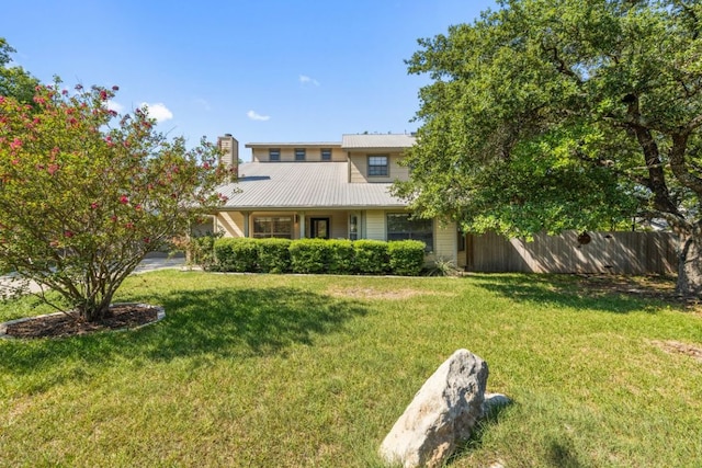 14406 Tucumcari Trl, Austin, TX 78734 - view of front of property featuring metal roof and a chimney