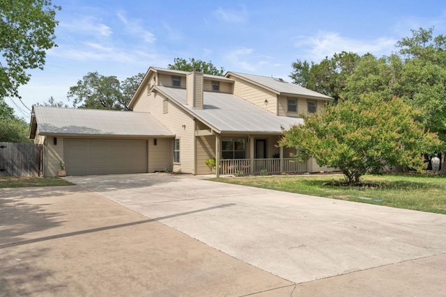 14406 Tucumcari Trl, Austin, TX 78734 - mid-century home with covered porch, a garage, driveway, metal roof, and a chimney