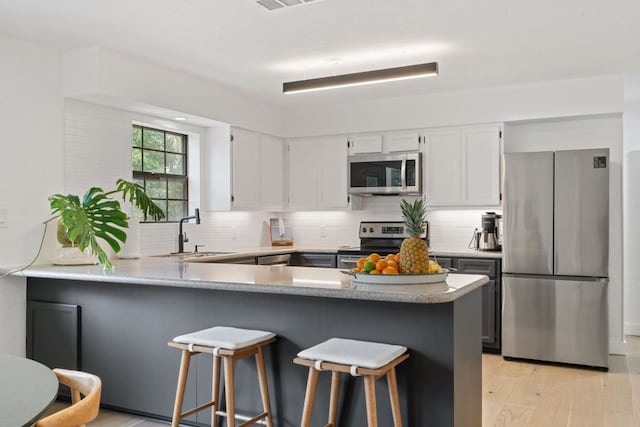 14406 Tucumcari Trl, Austin, TX 78734 - kitchen featuring stainless steel appliances, a sink, tasteful backsplash, and light countertops