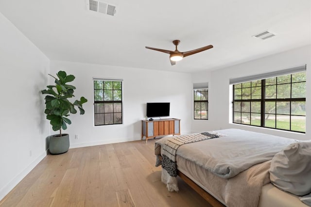 14406 Tucumcari Trl, Austin, TX 78734 - bedroom featuring light wood-type flooring, baseboards, and a ceiling fan