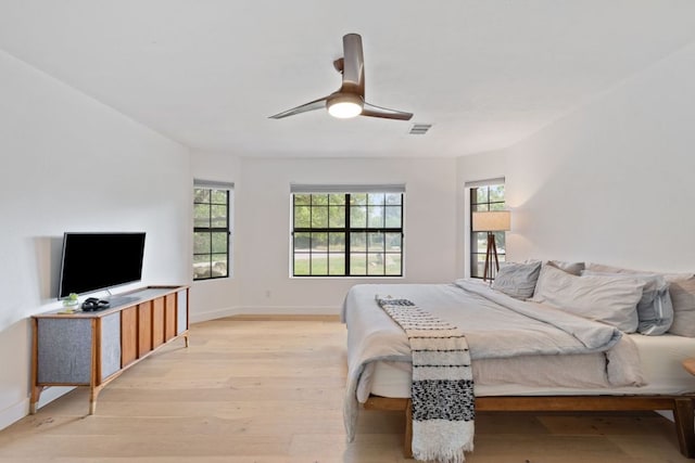 14406 Tucumcari Trl, Austin, TX 78734 - bedroom with light wood-type flooring, baseboards, and a ceiling fan