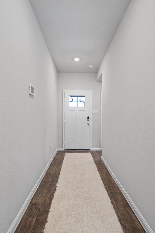 13921 Allan Shivers St, Manor, TX 78653 - doorway featuring dark wood-style floors, baseboards, and recessed lighting