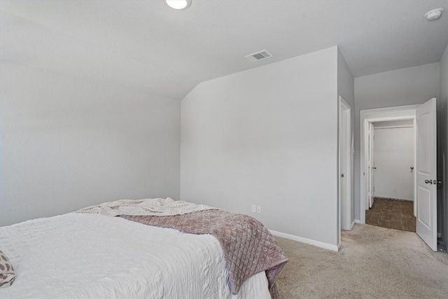 13921 Allan Shivers St, Manor, TX 78653 - bedroom with light carpet, baseboards, and vaulted ceiling
