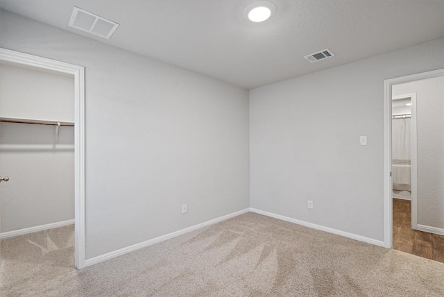 13921 Allan Shivers St, Manor, TX 78653 - unfurnished bedroom featuring carpet floors, baseboards, and a spacious closet