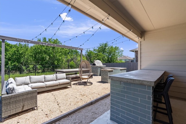 13921 Allan Shivers St, Manor, TX 78653 - fenced backyard with an outdoor hangout area and a patio area