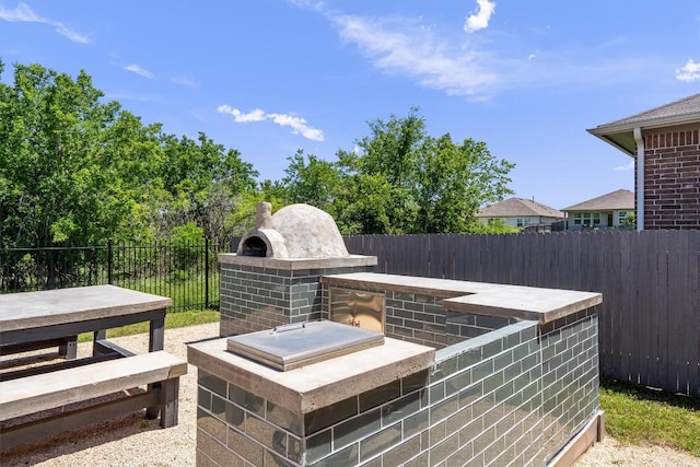 view of patio / terrace featuring fence