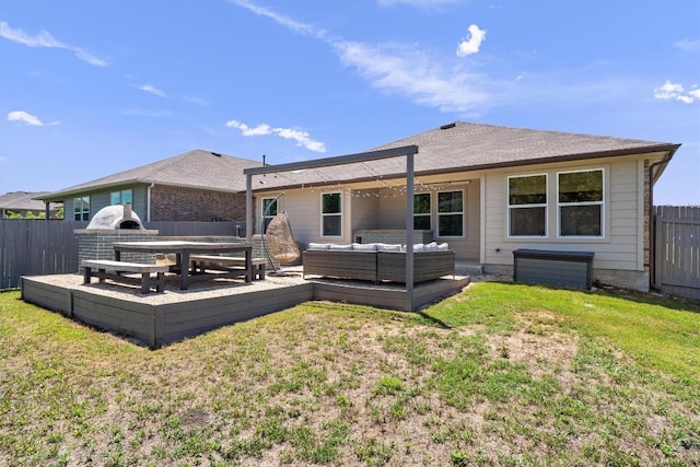 rear view of property featuring an outdoor hangout area and a wooden deck