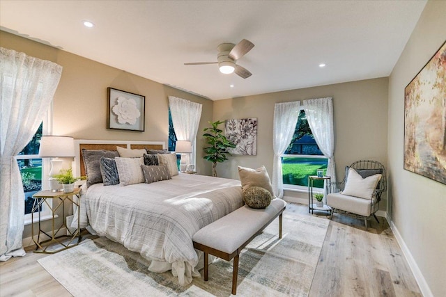 bedroom with wood finished floors, ceiling fan, recessed lighting, and baseboards