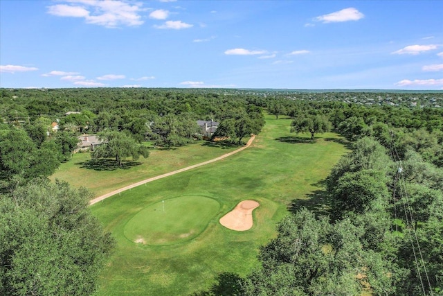 bird's eye view of a forest and a golf course