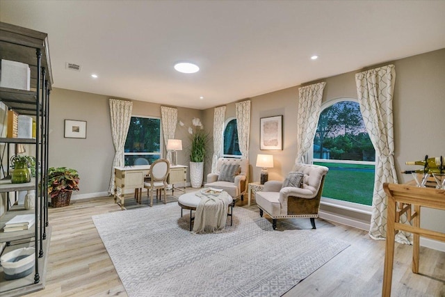 sitting room with light wood-style flooring, baseboards, and recessed lighting