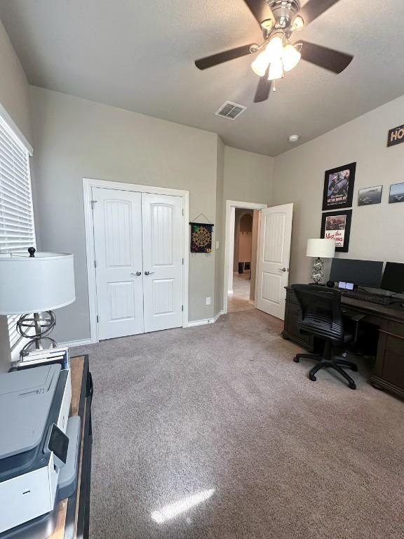 3119 Brand Iron Dr, San Marcos, TX 78666 - carpeted home office featuring ceiling fan and baseboards