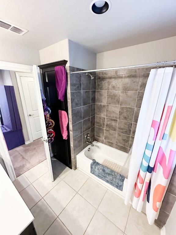 3119 Brand Iron Dr, San Marcos, TX 78666 - bathroom with tile patterned floors, shower / tub combo, and vanity