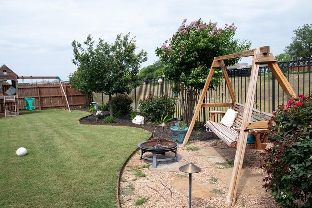 3119 Brand Iron Dr, San Marcos, TX 78666 - view of yard featuring a playground and an outdoor fire pit