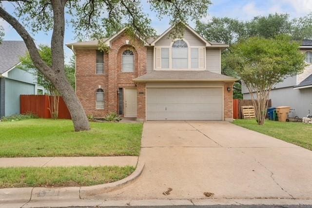 6200 La Naranja Ln, Austin, TX 78749 - traditional-style home with an attached garage, brick siding, and concrete driveway