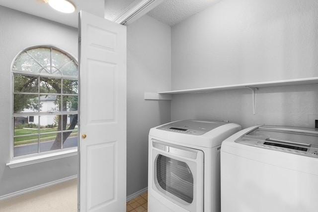 6200 La Naranja Ln, Austin, TX 78749 - clothes washing area featuring washer and dryer and baseboards