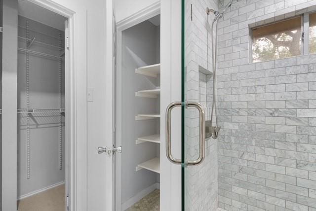 6200 La Naranja Ln, Austin, TX 78749 - bathroom featuring a shower stall and baseboards