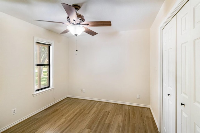 160 Turkey Run, Meadowlakes, TX 78654 - unfurnished bedroom with a closet, light wood finished floors, baseboards, and ceiling fan