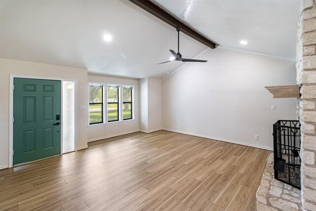 160 Turkey Run, Meadowlakes, TX 78654 - unfurnished living room featuring a ceiling fan, light wood finished floors, a stone fireplace, and baseboards