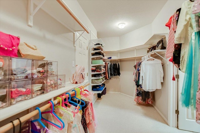 spacious closet featuring carpet