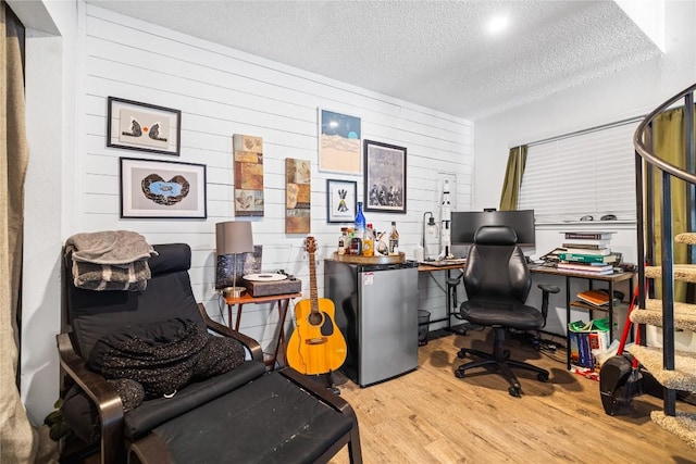 1840 Burton Dr Unit 110, Austin, TX 78741 - office area featuring a textured ceiling, wood finished floors, and wood walls