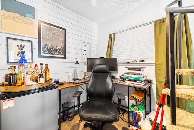 1840 Burton Dr Unit 110, Austin, TX 78741 - office space featuring wood walls, a textured ceiling, wood finished floors, and bar