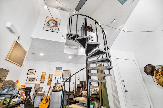 1840 Burton Dr Unit 110, Austin, TX 78741 - staircase featuring a towering ceiling