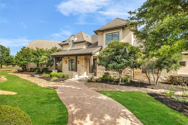 11705 Shoreview Overlook, Austin, TX 78732 - view of front of property featuring stone siding, stucco siding, and a front lawn