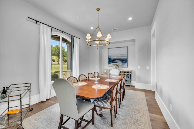 11705 Shoreview Overlook, Austin, TX 78732 - dining area featuring a chandelier, wood finished floors, and recessed lighting