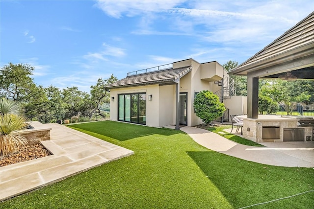 11705 Shoreview Overlook, Austin, TX 78732 - rear view of property with stucco siding, a yard, a patio, and exterior bar