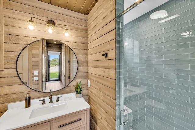 11705 Shoreview Overlook, Austin, TX 78732 - bathroom featuring vanity, a stall shower, and wood walls