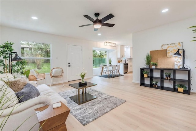 9606 Dallum Dr, Austin, TX 78753 - living room featuring light wood-style floors, a ceiling fan, recessed lighting, and baseboards