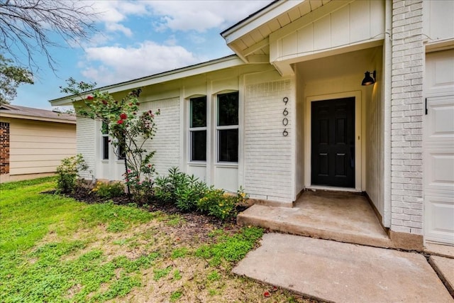 9606 Dallum Dr, Austin, TX 78753 - property entrance featuring brick siding and a yard