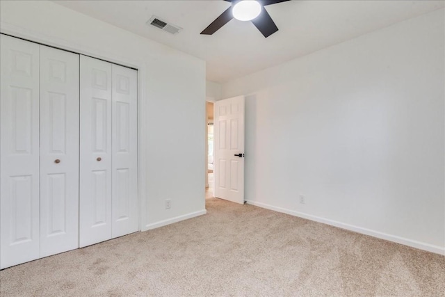 9606 Dallum Dr, Austin, TX 78753 - unfurnished bedroom featuring carpet flooring, baseboards, a closet, and a ceiling fan