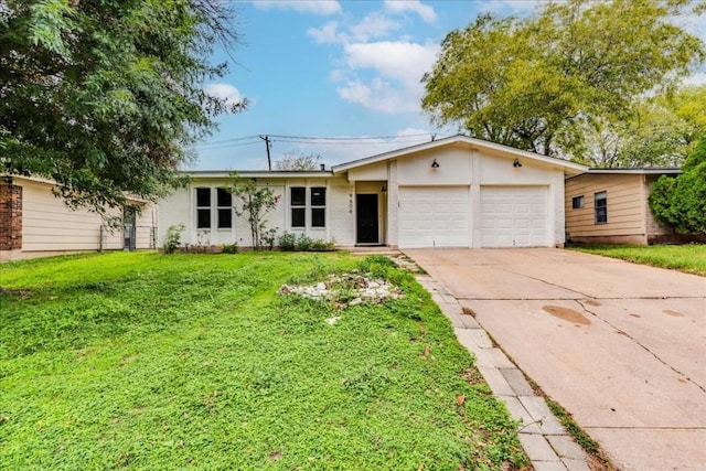 9606 Dallum Dr, Austin, TX 78753 - ranch-style home featuring an attached garage, driveway, and a front lawn