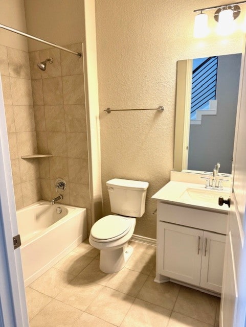 328 Milkwood Ter, Dripping Springs, TX 78620 - bathroom featuring toilet, tile patterned flooring, vanity, washtub / shower combination, and a textured wall