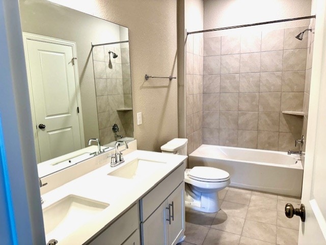 328 Milkwood Ter, Dripping Springs, TX 78620 - full bath featuring toilet, a textured wall, shower / bathtub combination, tile patterned flooring, and double vanity