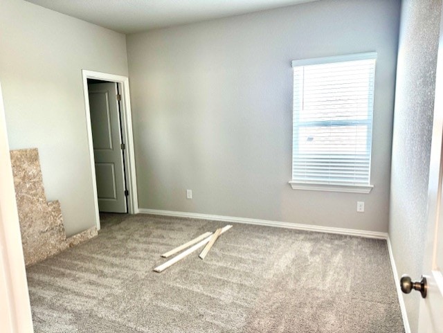 328 Milkwood Ter, Dripping Springs, TX 78620 - carpeted empty room featuring baseboards